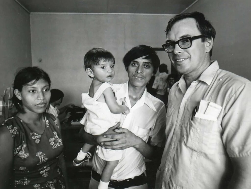 Dr. Donald Laub poses for a photo with a family of three